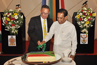 The High Commissioner of Sri Lanka, High Commissioner Doidge, and the Minister of Health, Mr Rajitha Senaratne, cutting the cake.