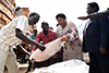 Deputy Minister Candith Mashego-Dlamini with Dr Manasseh Lomole, Chairperson of South Sudan's Relief and Rehabilitation Commission, during a handover ceremony of food aid to the Gezira Church, Juba, South Sudan, 8 August 2019.