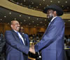 President Omar al-Bashir of Sudan and President Salva Kirr of South Sudan greet each other during the opening event of the African Union, 15 July 2012.