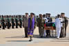 Mortal Remains of President Bingu wa Mutharika of Malawi is returned to Malawi from Pretoria, South Africa. Front: Chaplain General (SANDF) Mr Monwabisi Jamangile just behind Chaplain, Gen Lesley Ford. Bearers to the left: SCWO Clement Mokala, SCWO Raj Narrain, SCWO Dan Tshabalala and SCWO Thando Gogo. Bearers to the right: SCWO Prgasen Moodley, SCWO Moses Sibane and SCWO Fanie Roos.