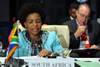 Minister Maite Nkoana-Mashabane addresses the Ministerial Meeting of the Non-Aligned Movement (NAM) Coordinating Bureau (COB). The Head of Official Delegation, Mr Henk van der Westhuisen, is seated behind her.