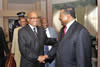 President Jacob Zuma shakes hands with Mr Jean Ping, Chairperson of the Commission of the African Union, before his departure from Cotonou International Airport, Cotonou, Benin.
