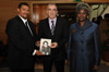 Deputy Minister Fransman; the Mayor of Arcueil, Mr Daniel Breuiller; and South Africa's Ambassador to France, Ms Dolana Msimang; hold a book written by Ms Jacqueline Derens Commemorating the life of Ms Dulcie September, Arcueil, France, 29 March 2013.