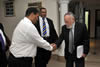 Deputy Minister Marius Fransman greets Professor Cyril Karabus inside the South African Embassy in Abu Dhabi, United Arab Emirates. Pictured in the centre is Mr Kevin Oosthuizen, Chargé d'Affairs of the South African Embassy in Abu Dhabi, United Arab Emirates, 3 March 2013.