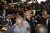 Prof. Karabus arrives at the Cape Town International Airport. He is met by his family while coming off the plane and the crowds of Cape Town Community members welcome him back home, Cape Town International Airport, 17 May 2013.