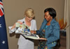 Minister Maite Nkoana-Mashabane and the Minister of Foreign Affairs of Australia, Julie Bishop, share a light moment as they look at the images from the Bilateral Consultations, Pretoria, South Africa, 11 September 2014.