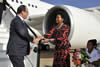 President François Hollande of France arrives at the Waterkloof Air Force Base, Pretoria, South Africa. He is received by the Minister of International Relations and Cooperation, Ms Maite Nkoana-Mashabane. Holding welcoming flowers for President François Hollande, is Gontse Mokokap (5 years old) from Pretoria, 14 October 2013.