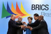 Leaders of the Federative Republic of Brazil, the Russian Federation, the Republic of India, the People’s Republic of China and the Republic of South Africa, at the Sixth BRICS Summit, Fortaleza, Brazil, 14 -16 July 2014.