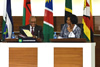 President Jacob Zuma, Chair of the SADC Troika, shares a light moment with Minister Maite Nkoana-Mashabane before the opening session of the SADC Double Troika plus Two, Pretoria, South Africa, 15 September 2014.