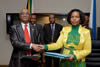 Minister Maite Nkoana-Mashabane signs an agreement with the Foreign Minister of Djibouti, Mr Mahmoud Ali Youssouf, Sandton, Johannesburg, South Africa, 11 June 2015.