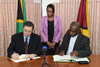 Deputy Minister Luwellyn Landers and the Minister of Foreign Affairs, Hon. Carl B Greenidge, sign the Memorandum of Understanding (MoU) on Political Consultations, Georgetown, Guyana, 30 June 2015.