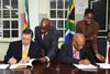 Deputy Minister Luwellyn Landers with the Minister of Foreign Affairs, Mr W Lackin, at the Signing of the Memorandum of Understanding on Political Consultation, Paramaribo, Suriname, 2 July 2015.