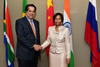 Minister Maite Nkoana-Mashabane greets the President of the BRICS Development Bank, Mr KV Kamath, as she hosts him for a luncheon at the O R Tambo Building, Pretoria, South Africa, 1 December 2015.
