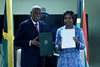 Minister Maite Nkoana-Mashabane and the Minister of Foreign Affairs and Foreign Trade, Senator Arnold J. Nicholson, QC, of Jamaica, hold up signed Memorandum of Understanding on the Establishment of Political Consultations at the conclusion of the Bilateral Meeting, Kingston, Jamaica, 20-22 September 2015.