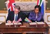 Minister Maite Nkoana-Mashabane and the Secretary of State, RT Hounorable Phillip Hammond, of the United Kingdom, sign and exchange the Joint Communiqué at the conclusion of the Eleventh South Africa – United Kingdom Bilateral Forum, London, United Kingdom of Britain, 19 October 2015.