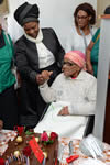 Deputy Minister Nomaindiya Mfeketo hands over a house and celebrates the birthday of Ouma Sara Saas, Rondevlei, Cape Town, South Africa, 8 October 2015.
