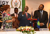 President Mugabe, Chairperson of SADC, hands over the deed and keys for the SADC RPTC to the SADC Executive Secretary, Dr Tax, at the opening session of SADC Extra-Ordinary Summit of Heads of State and Government on Industrialisation, Harare, Zimbabwe, 29 April 2015.