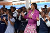 Minister Maite Nkoana-Mashabane hands over school shoes to scholars during her visit to Primary Schools, Limpopo, South Africa, 5 February 2016.