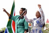 Minister Maite Nkoana-Mashabane dances with Winnie Mashaba during the International Women’s Day event, Mokomene Stadium, Ga-Ramokgopa, Limpopo Province, South Africa, 12 March 2016.